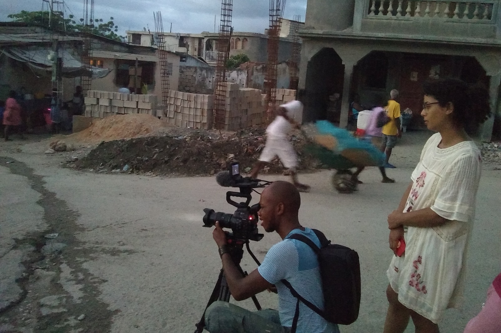 Filmmaker with camera in a street