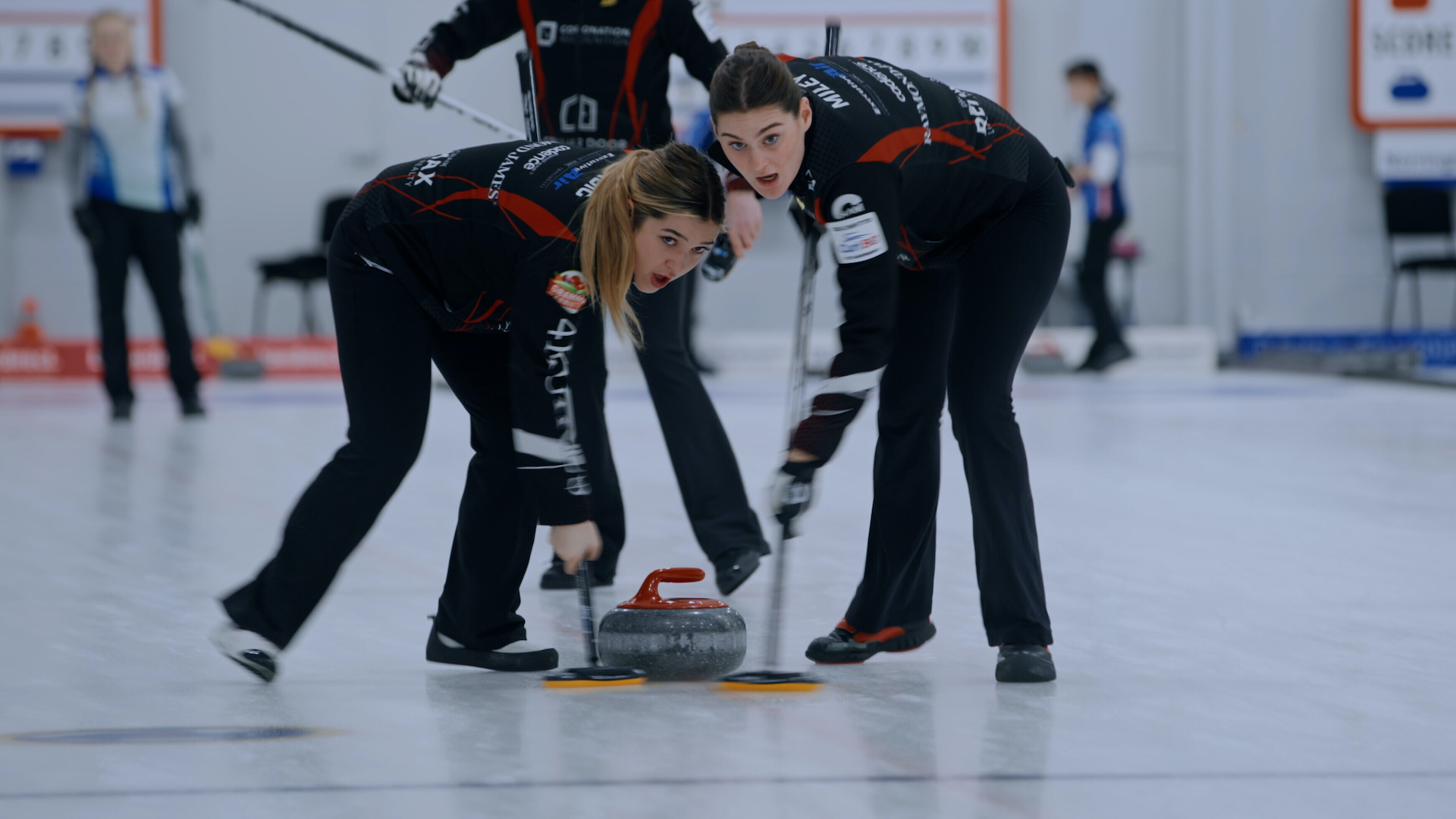 Two teenage girls curling